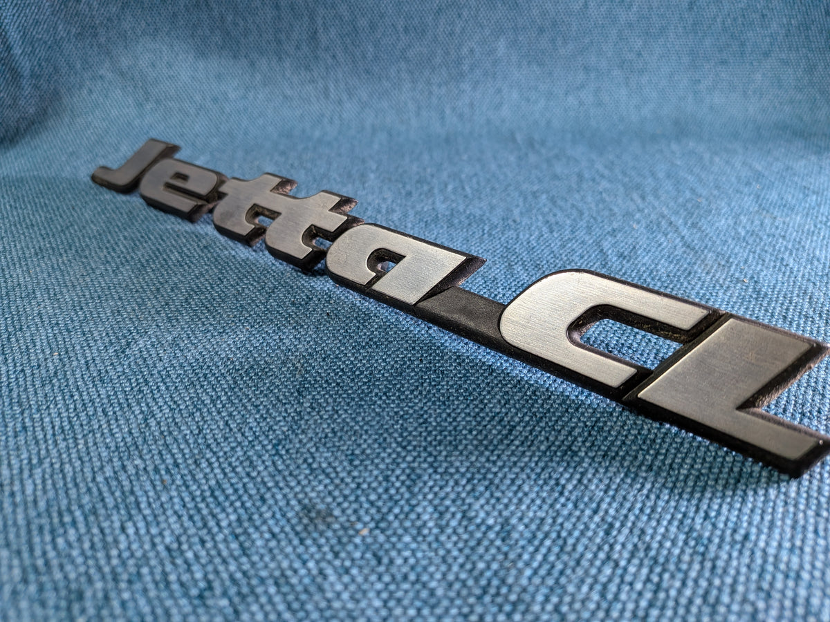 Jetta 2 CL Emblem Schriftzug Logo 165853687J Gebraucht B10