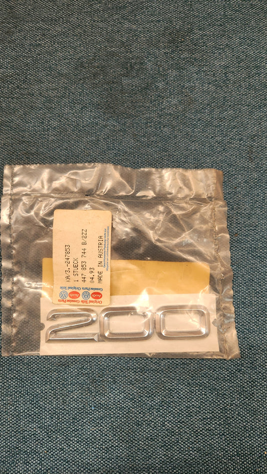 Audi 200 C3/C4 Emblem/Schriftzug 447853744 Nos H7